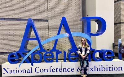 Katie Taylor, woman, standing in front of the letters A-A-P
